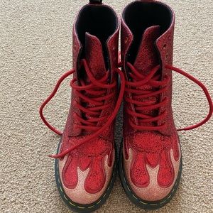 Red flame sparkles Doc Martens.